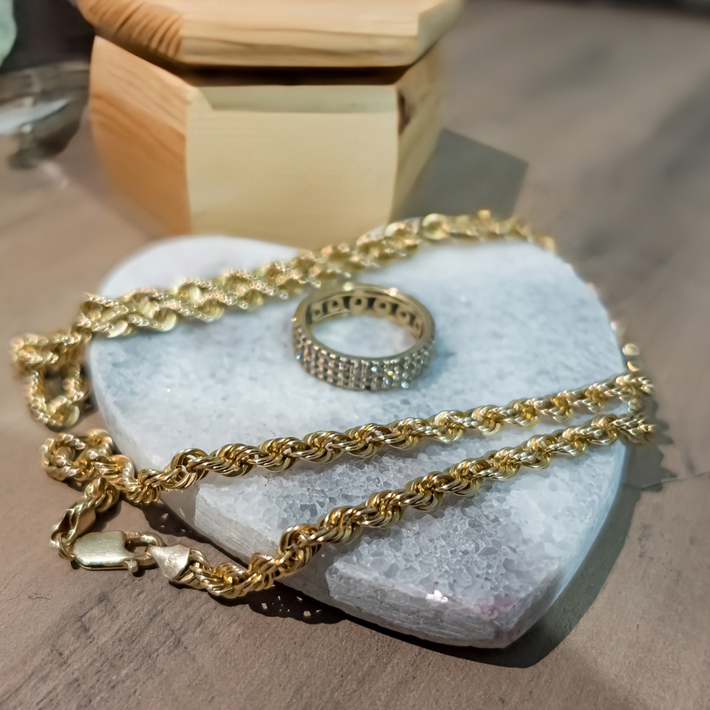 26in 10k Semi-Solid Rope chain and 10K Yellow Gold 2.75 CARAT eternity band.